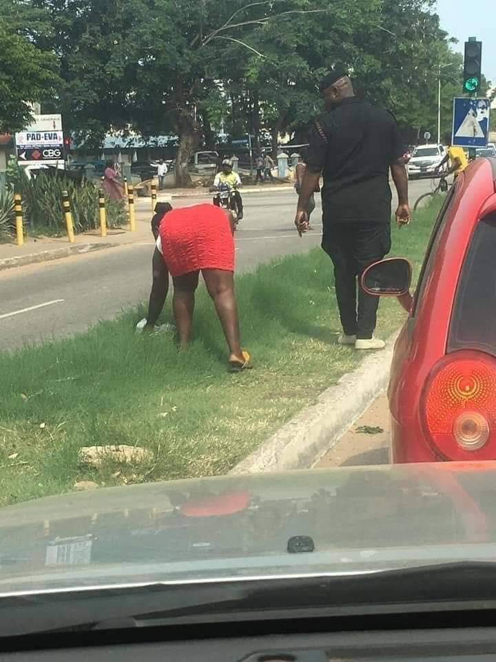 Photo of a ordered by police officer to pick rubbish for littering 