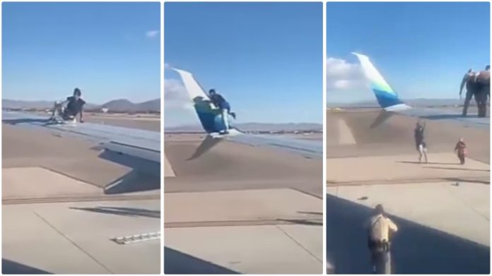 Man jumps on plane wing