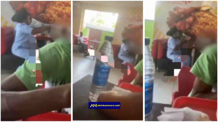couple Ignore housemaid while they eat with their kid