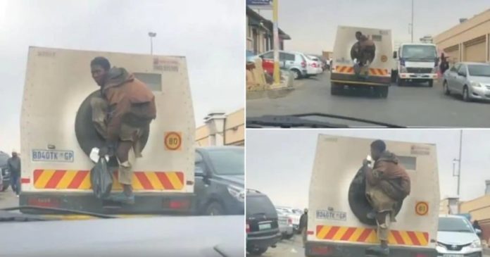Man causes stir online after jumping on money truck