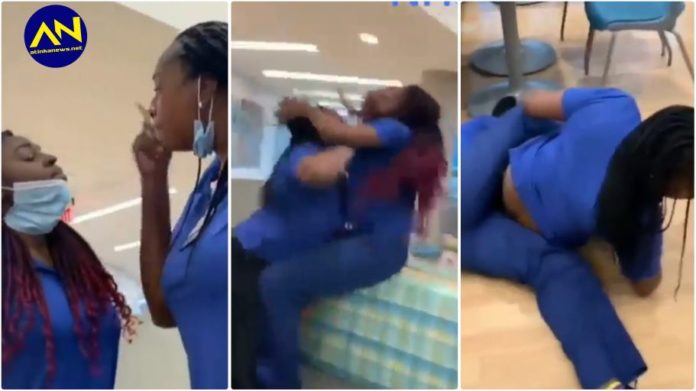 Two female nurses fight in a hospital canteen