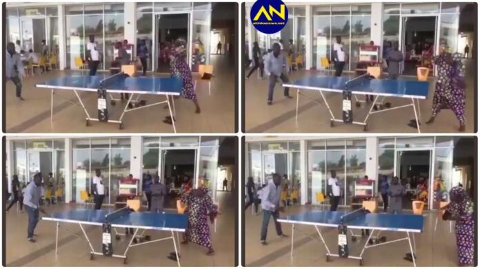 Barefooted woman in ankara teaches' man serious lesson during table tennis game