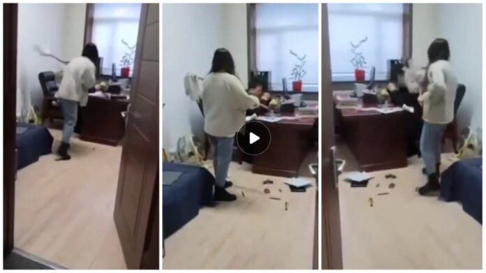 Woman flogs her boss with mop stick