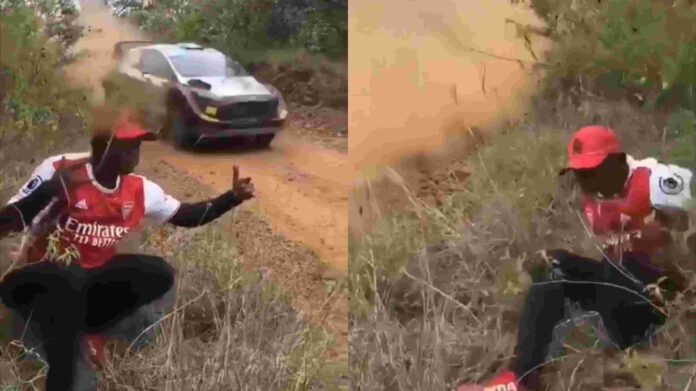Daring man almost hit by a rally car while trying to get the best photoshot