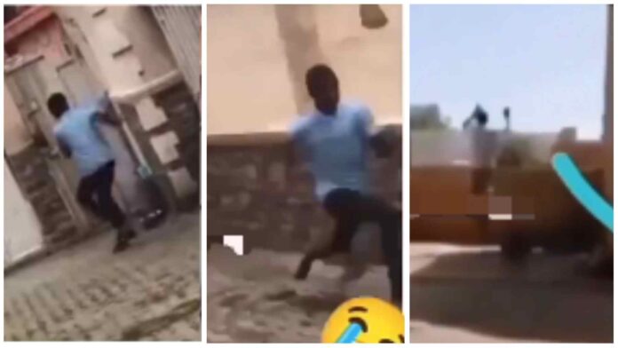 boy being chased by a dog jumped over a high fence without touching it