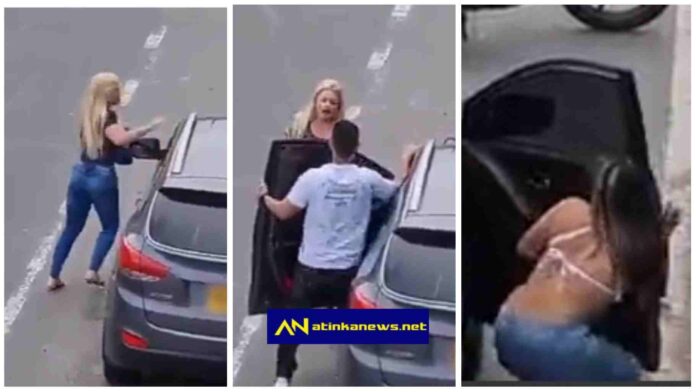 Woman catches her man banging another woman in a car on the roadside