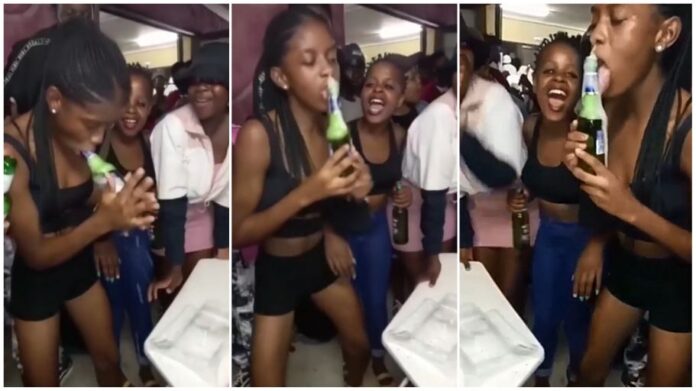 Video of young woman sucking on a beer bottle