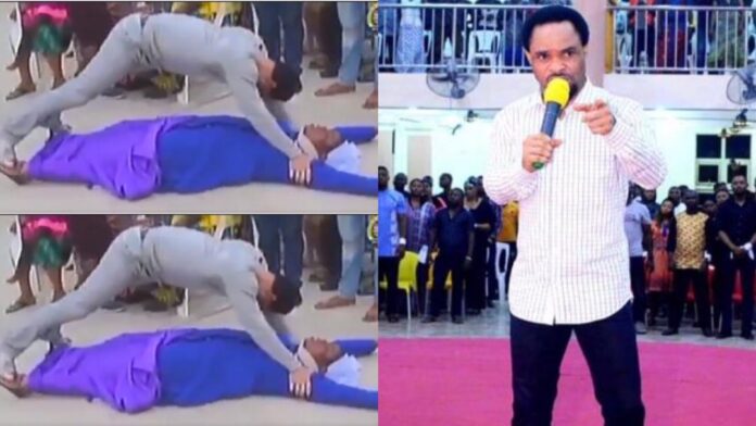 Prophet stands on all fours as he conducts deliverance on a Reverend Sister