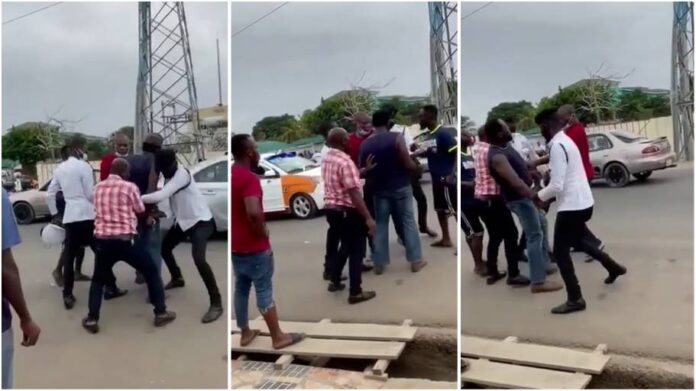 Ghana police officers struggle to arrest driver
