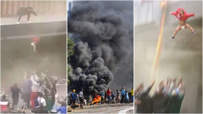 South African chaos : Trapped Mother forced to throw child from burning building
