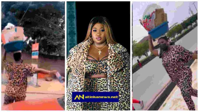 Sista Afia causes stir as she is spotted selling sachet water in traffic