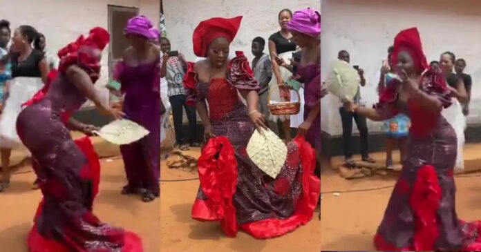 Bride wedding video goes viral as she uses coal pot fan as bridal fan [Watch]