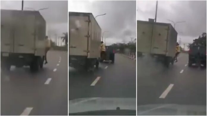 traffic police officer falls off a truck while trying to arrest the driver