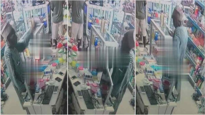CCTV exposes old man stealing mobile phone from a pharmacy in Mafia style