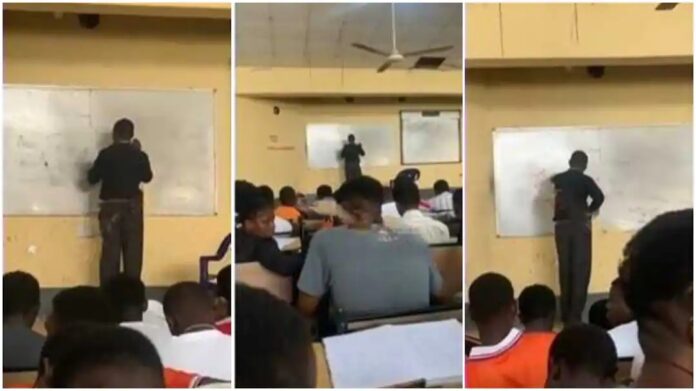 lecturer trying to solve a Physics question in a class