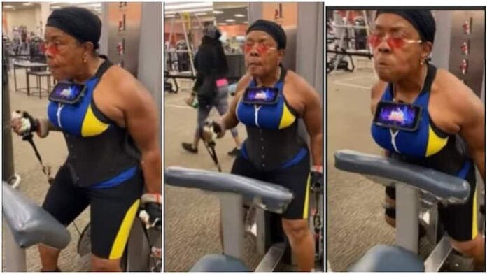 Grandma with big muscles exercising in gym