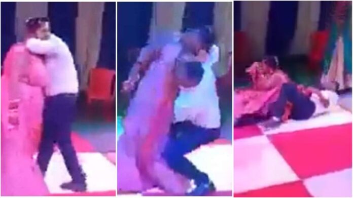 Groom falls along with bride while trying to lift her during dance at their wedding
