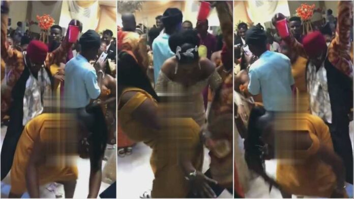 Bride pushes lady dancing with the groom