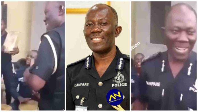 IGP Dampare spotted singing Jama song with a group of Policemen