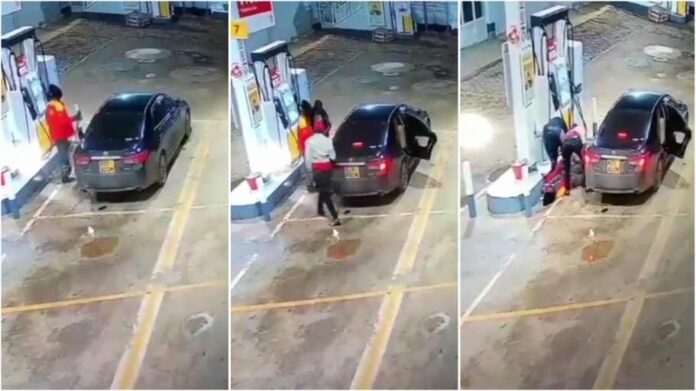 Thugs robbing petrol station attendant