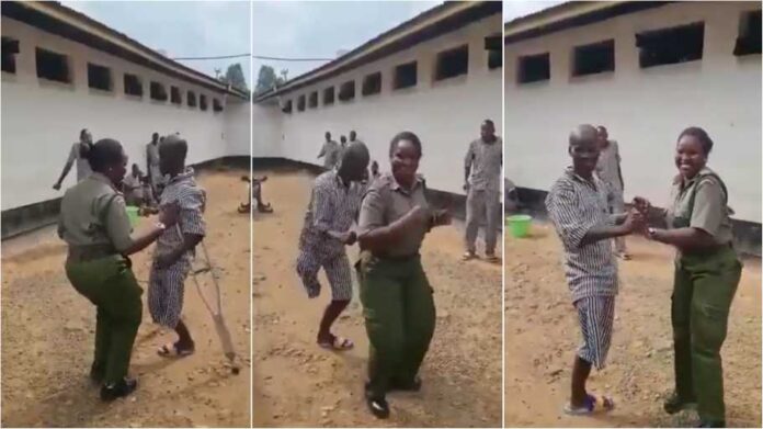 female prison warden and physically challenged prisoner dance