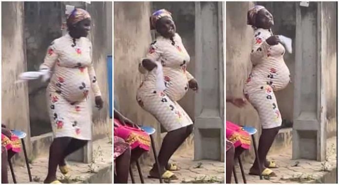 heavily pregnant woman dancing