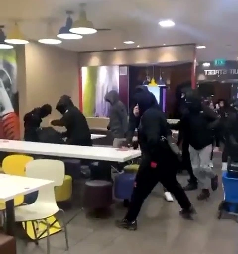 Moment thugs unleash brutal attack in McDonalds and throw chairs at victim 1