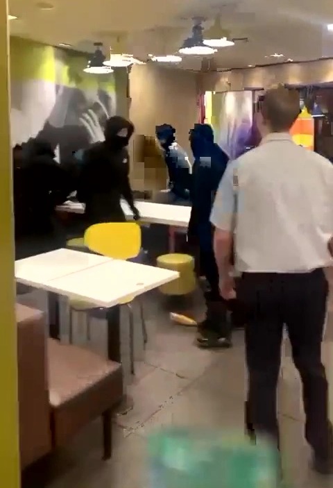 Moment thugs unleash brutal attack in McDonalds and throw chairs at victim